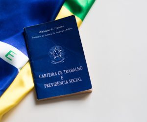 Brazilian work card with the Brazilian flag in the background.